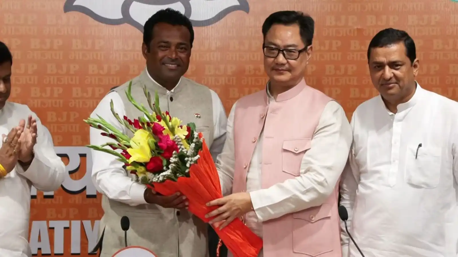 former tennis star leander paes joins bjp with union minister kiren rijiju present at the event