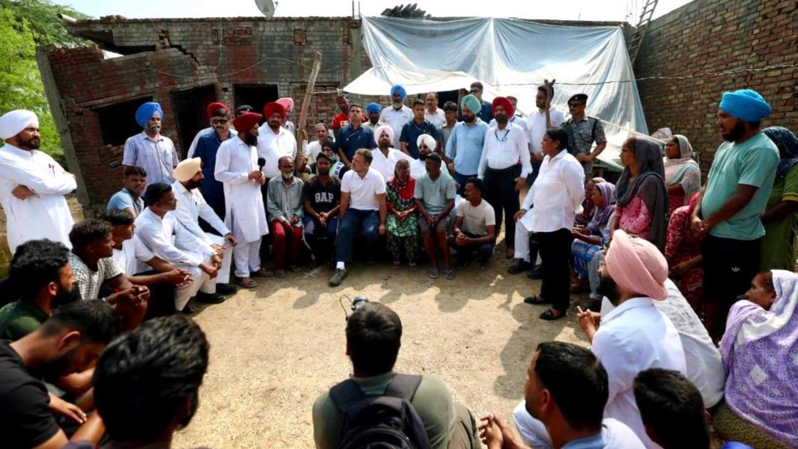 punjab rahul gandhi meets flood victims state minister bittu taunts when punjab was drowning he was on holiday