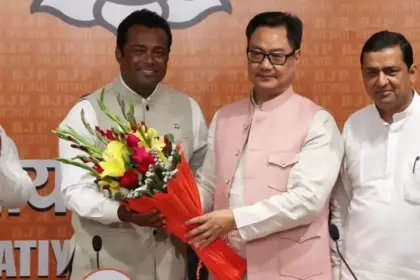 former tennis star leander paes joins bjp with union minister kiren rijiju present at the event