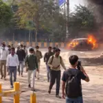noida workers violent protest salary hike demand vehicles vandalized fire